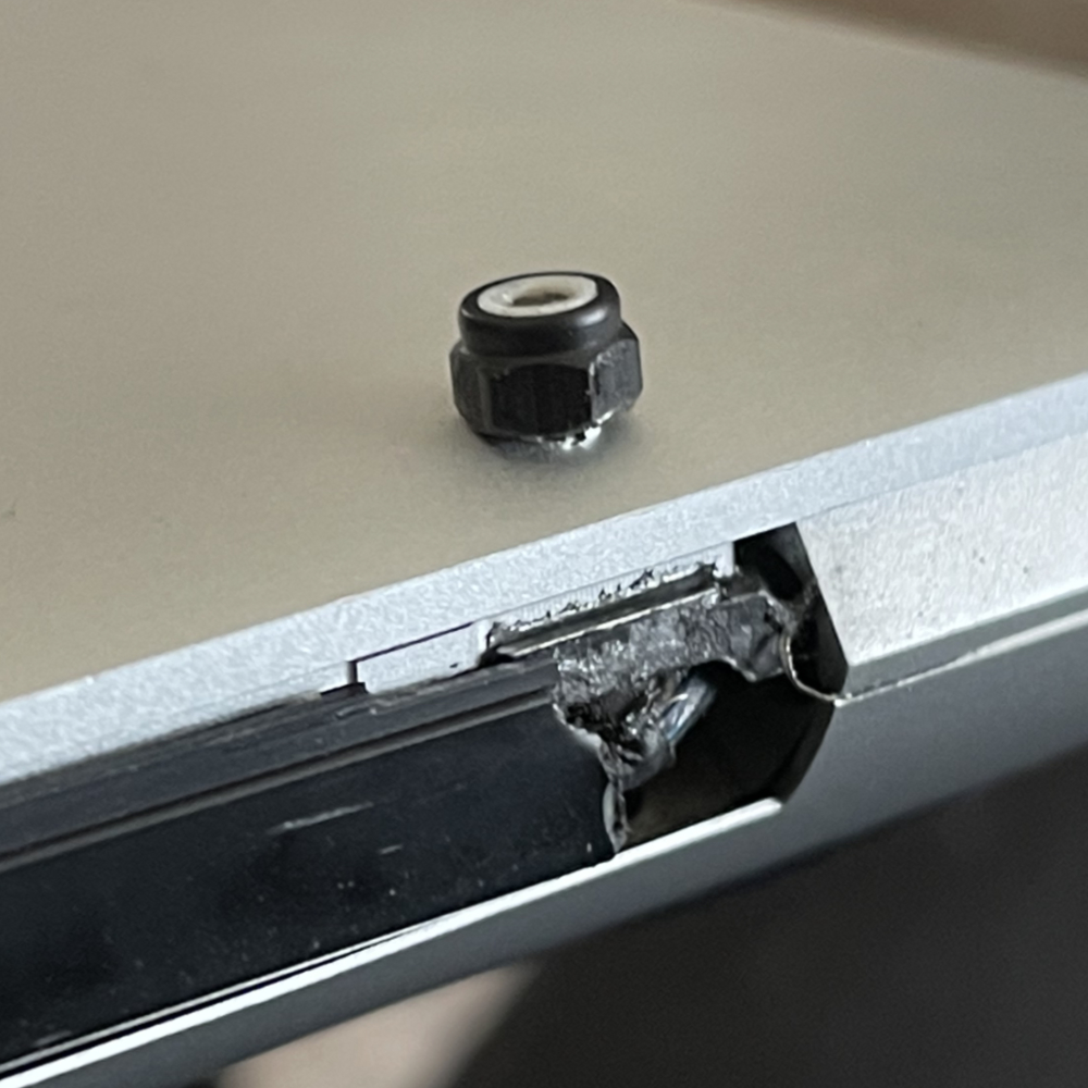 lock nut on shell of laptop